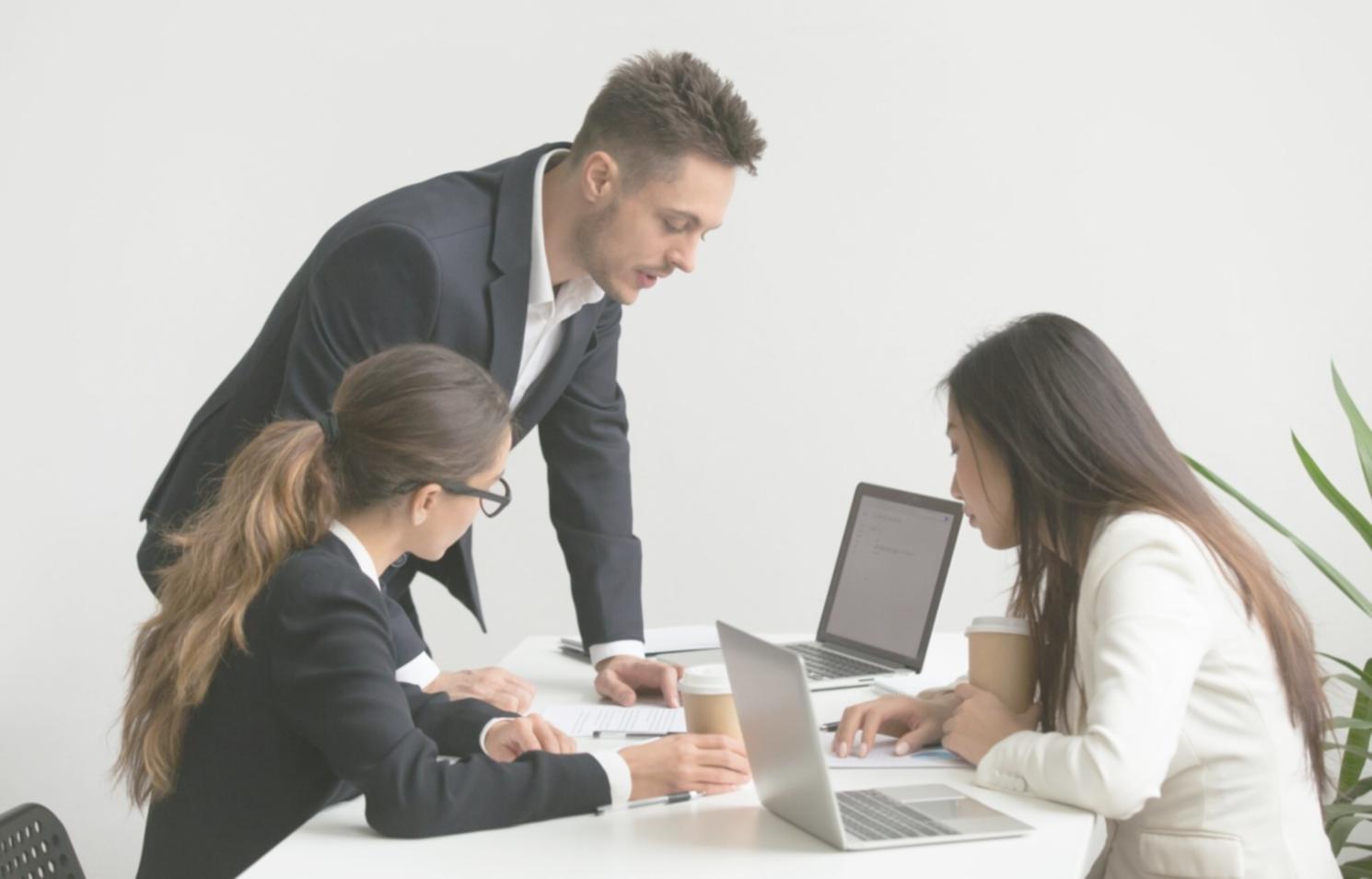 Professional financial consultation meeting showing documents and planning materials