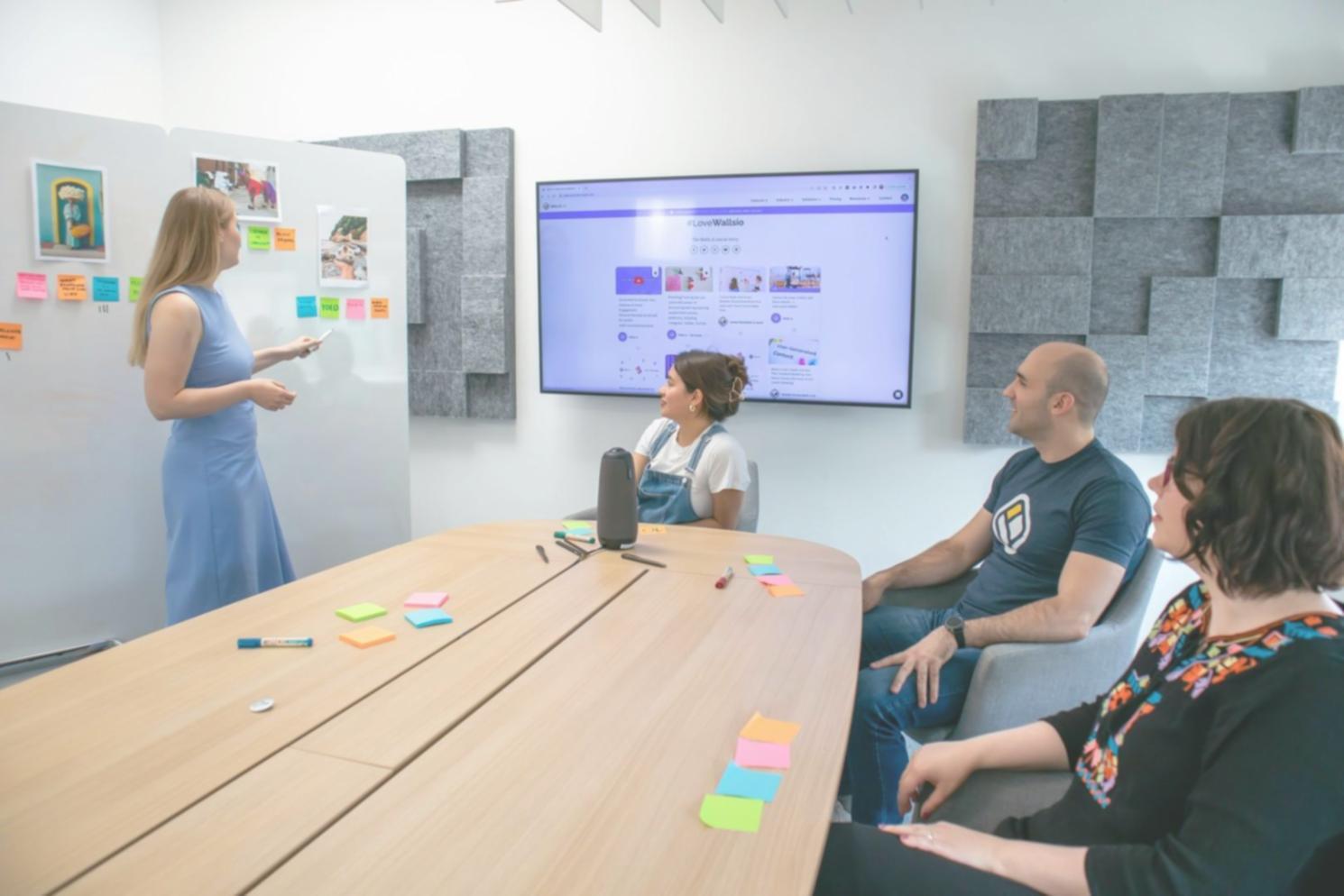 Students engaged in collaborative financial planning workshop with charts and calculators